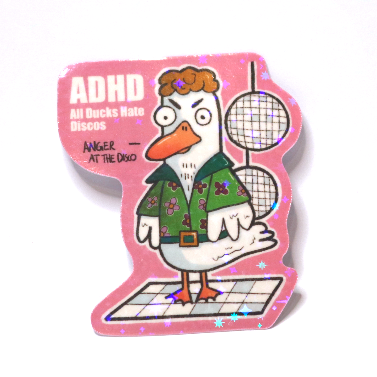 Sticker of an angry duck in an 80s disco outfit on a dance floor with disco balls, with the slogan ‘ADHD – All Ducks Hate Discos.’