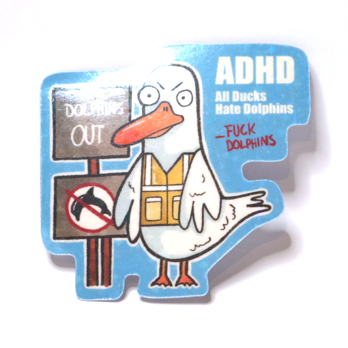 Sticker of an angry duck in a safety vest protesting with signs against dolphins, with the slogan ‘ADHD – All Ducks Hate Dolphins.’