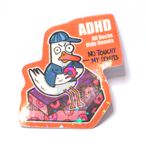 Sticker of an angry duck in blue clothes sitting on donut boxes, holding a donut, with the slogan ‘ADHD – All Ducks Hide Donuts.’
