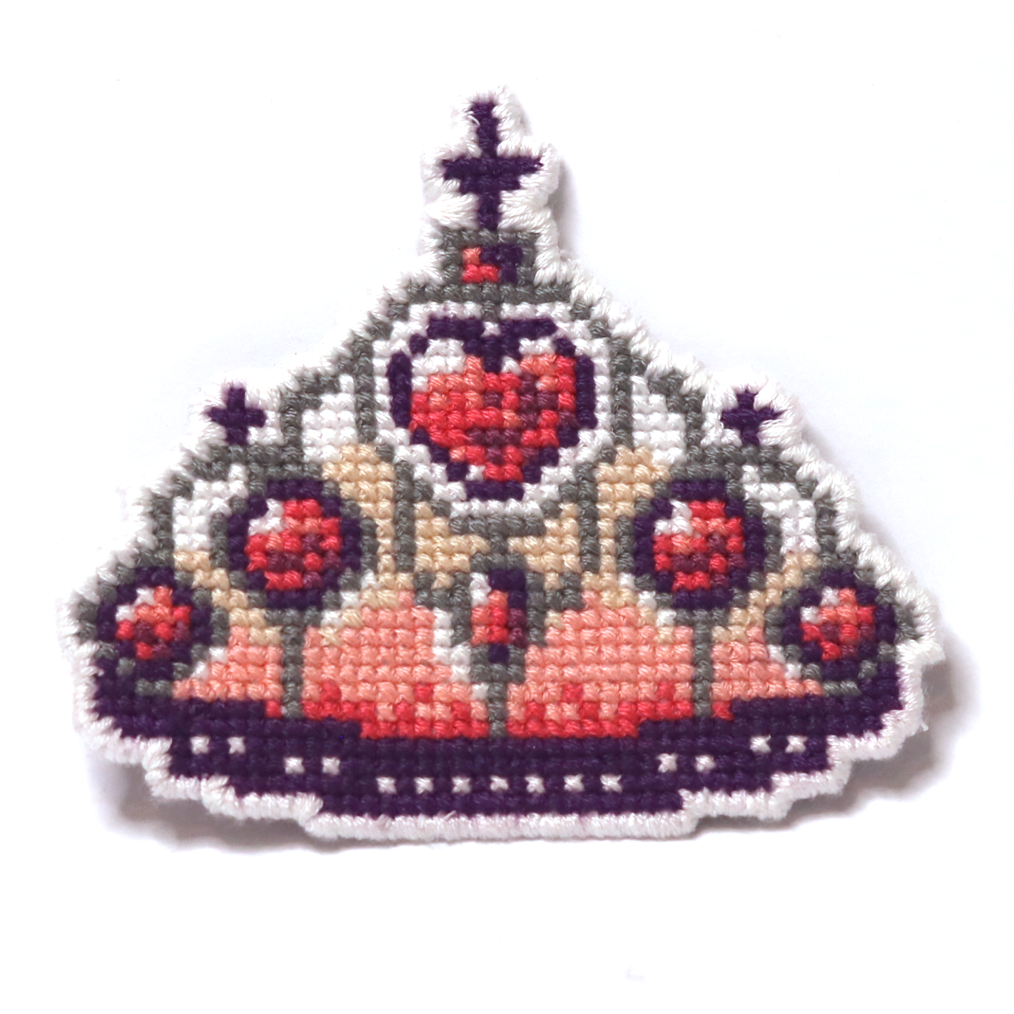 Cross-stitch Barbie-style crown with red hearts and purple details on a white background.