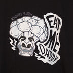 Close-up of the broccoli graphic and Eat Me Daddy lettering on the black T-shirt