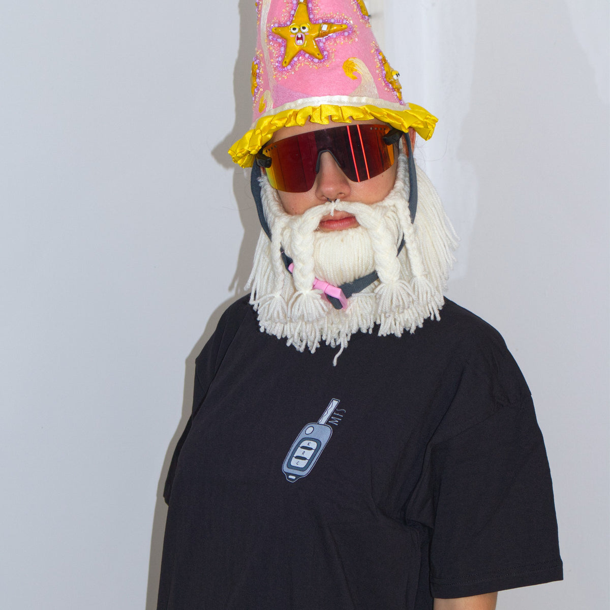 Ride Chicken T-shirt worn by the Wizard, showing the small front car key print