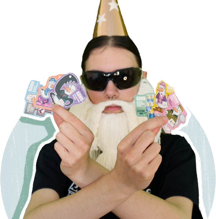 Crafting Wizard holding six ADHD duck stickers in front of a drawn circle