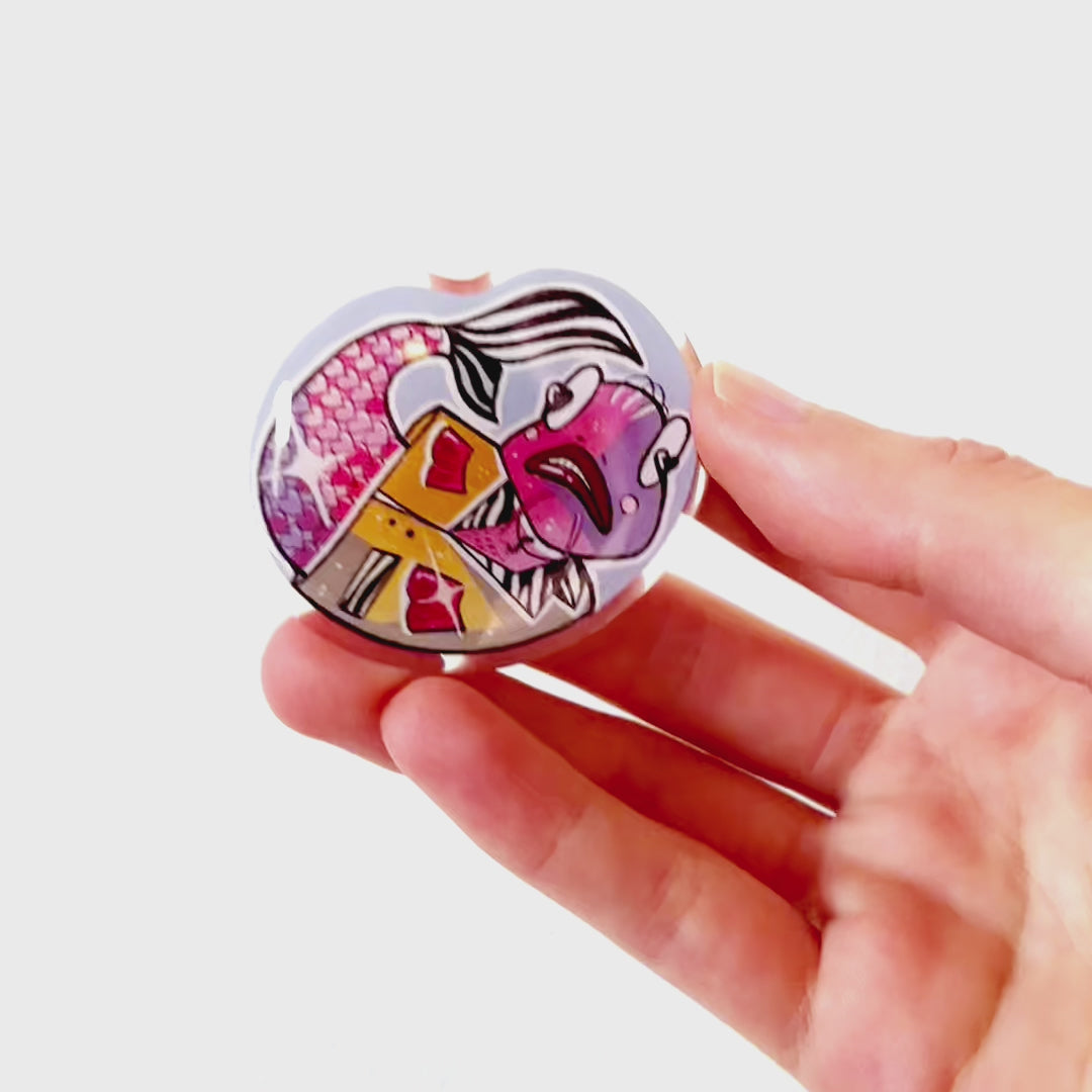 Video: Acrylic pin of a flashy pimp-style fish in a yellow zebra-pattern jacket, with heart-shaped scales and an over-the-top gangster vibe.