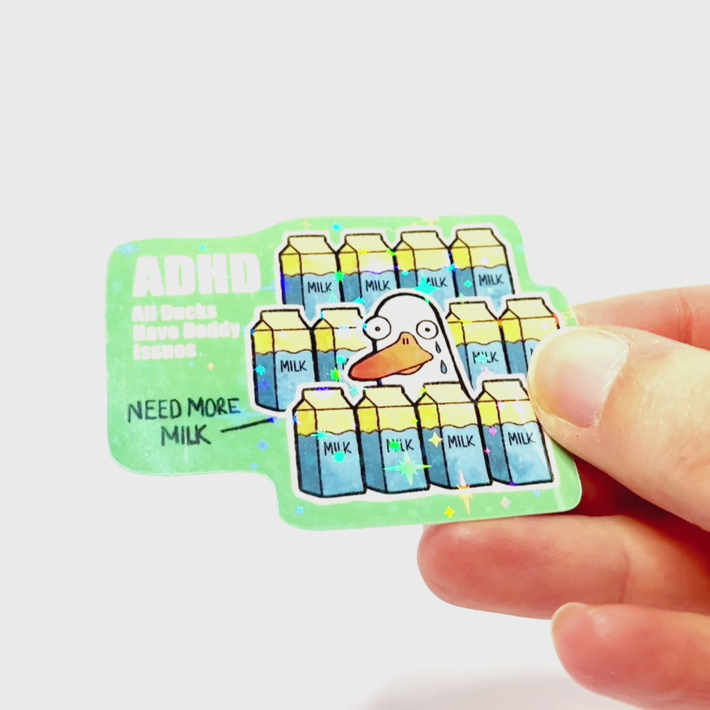 Video: Sticker of a sad duck surrounded by milk cartons with tears on its face, with the slogan ‘ADHD – All Ducks Have Daddy Issues.’