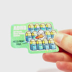 Video: Sticker of a sad duck surrounded by milk cartons with tears on its face, with the slogan ‘ADHD – All Ducks Have Daddy Issues.’
