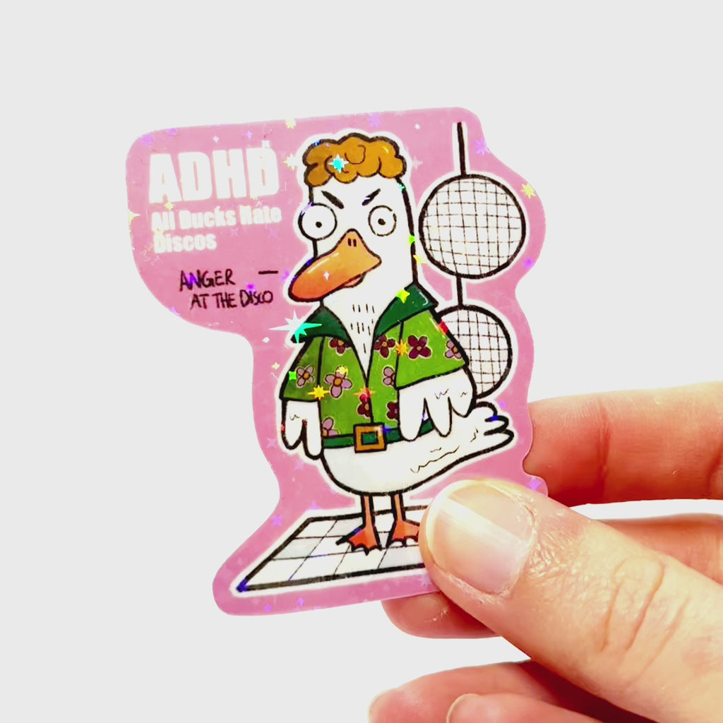 Video: Sticker of an angry duck in an 80s disco outfit on a dance floor with disco balls, with the slogan ‘ADHD – All Ducks Hate Discos.’