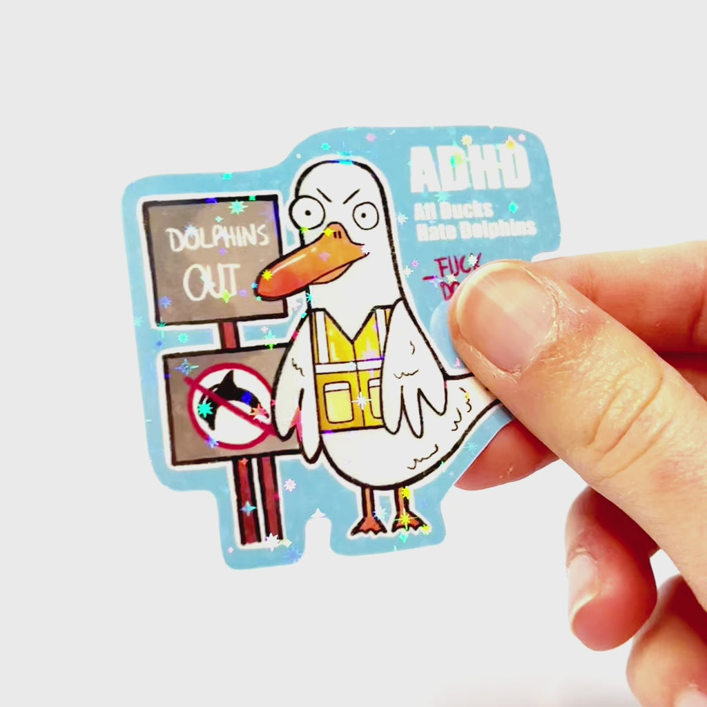 Video: Sticker of an angry duck in a safety vest protesting with signs against dolphins, with the slogan ‘ADHD – All Ducks Hate Dolphins.’
